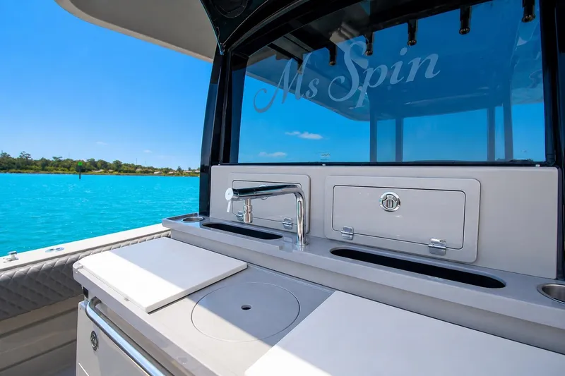 Slide: The Image of Luxury 2022 HCB 42 Lujo yacht with sleek outdoor kitchen setup. - 8