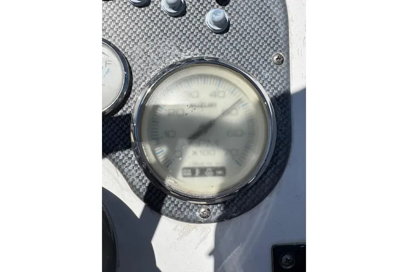 Slide: The Image of Close-up of a 2012 Carolina Skiff 1765 DLX boat dashboard with speedometer. - 18