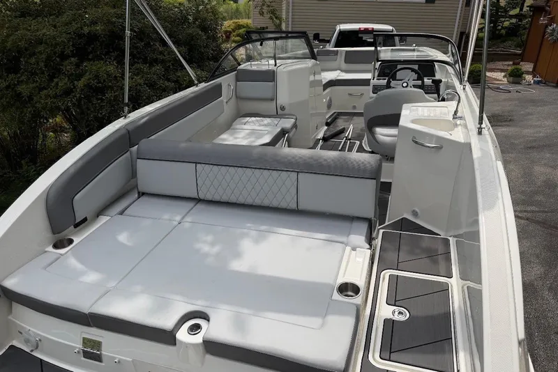 Slide: The Image of 2023 Bayliner DX 2200 boat interior with spacious seating and modern design. - 3