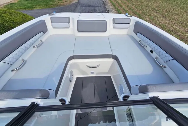 Slide: The Image of 2023 Bayliner DX 2200 boat interior with spacious seating and modern design. - 4