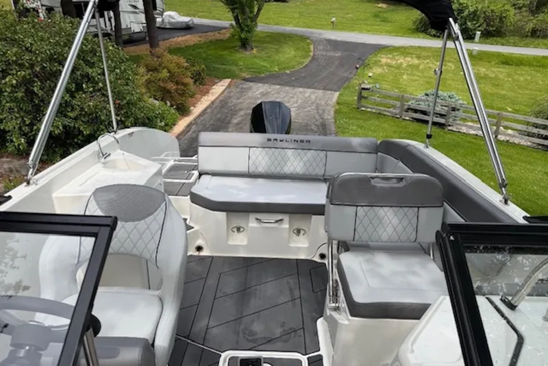 Slide: The Image of 2023 Bayliner DX 2200 boat interior with modern seating and sleek design. - 6