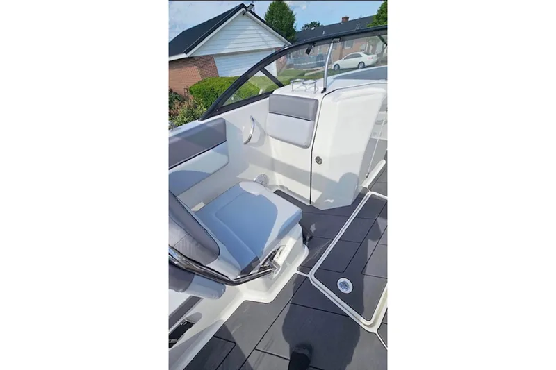 Slide: The Image of 2023 Bayliner DX 2200 boat interior with sleek seating and modern design. - 8