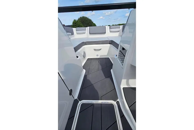 Slide: The Image of 2023 Bayliner DX 2200 boat interior with sleek seating and modern design. - 9