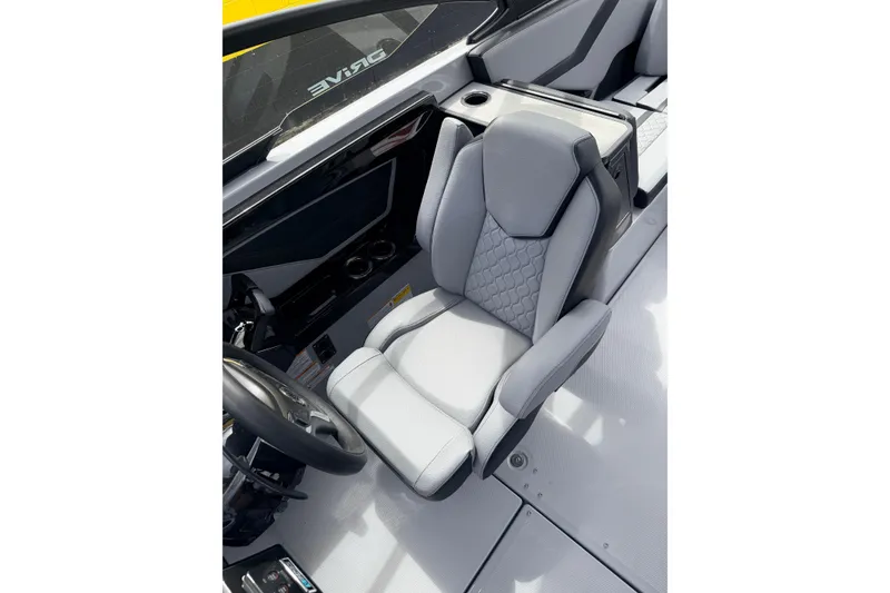 Slide: The Image of 2026 Yamaha Boats 255XD interior with sleek, modern gray seating and steering wheel. - 11