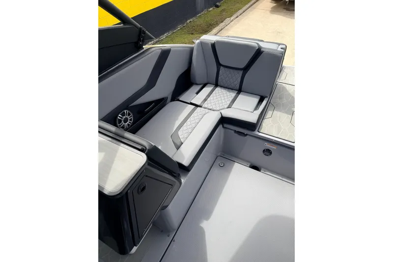 Slide: The Image of 2026 Yamaha Boats 255XD interior with sleek gray seating and modern design. - 13
