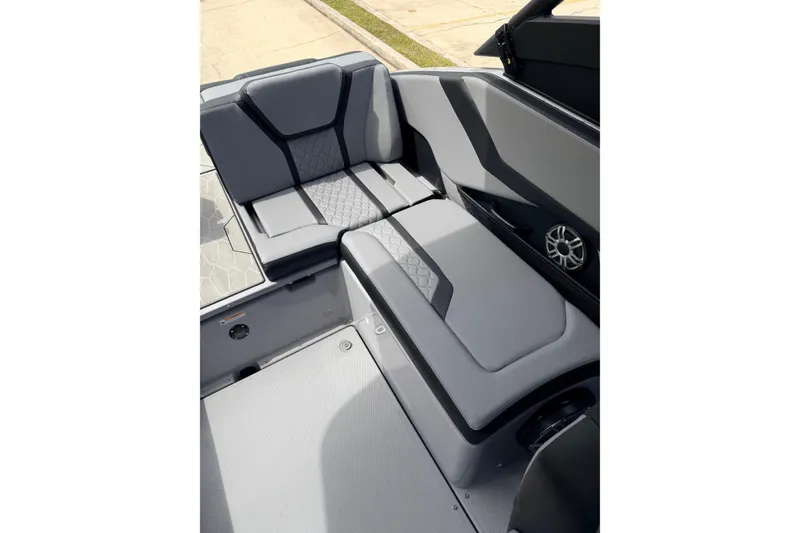 Slide: The Image of 2026 Yamaha Boats 255XD interior seating with modern design and speaker detail. - 14