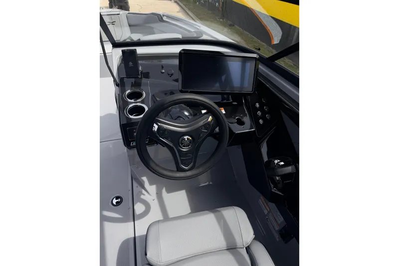 Slide: The Image of 2026 Yamaha Boats 255XD cockpit with steering wheel, touchscreen display, and modern controls. - 15