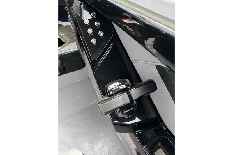 Slide: The Image of 2026 Yamaha Boats 255XD control panel with sleek black and silver design. - 16