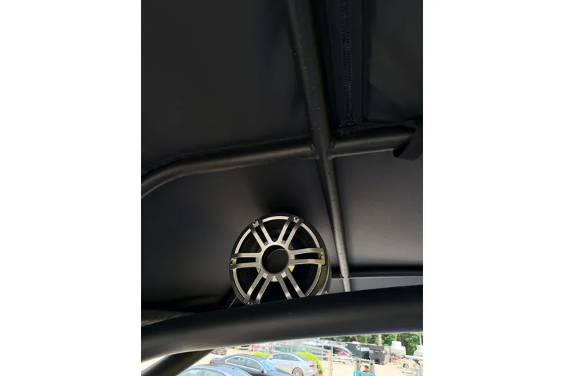 Slide: The Image of Speaker system on 2026 Yamaha Boats 255XD, mounted under a black canopy. - 17