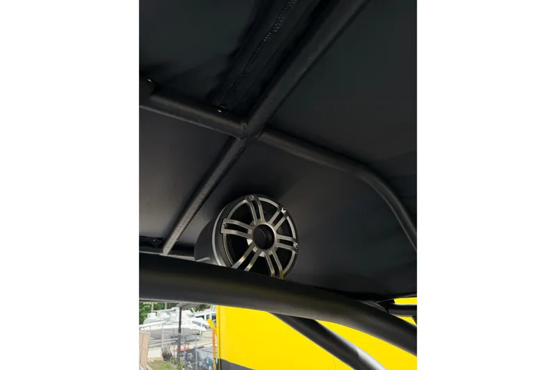 Slide: The Image of Speaker mounted on Yamaha Boats 255XD, 2026 model, under black canopy. - 18