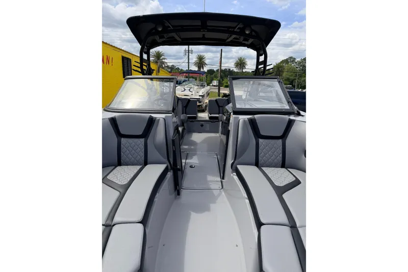 Slide: The Image of 2026 Yamaha Boats 255XD interior with sleek seating and modern design. - 6