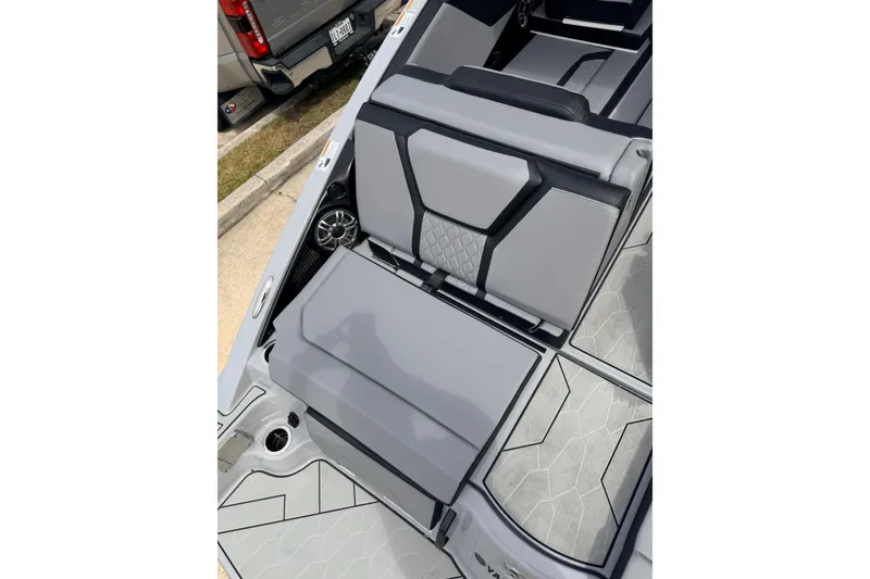 Slide: The Image of 2026 Yamaha Boats 255XD interior with sleek gray seating and modern design. - 7