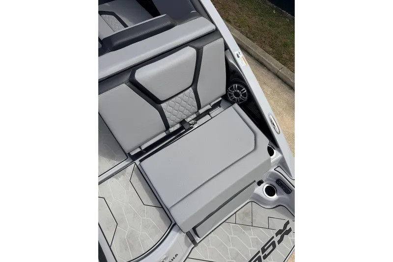 Slide: The Image of 2026 Yamaha Boats 255XD interior seating with sleek gray upholstery and modern design. - 8