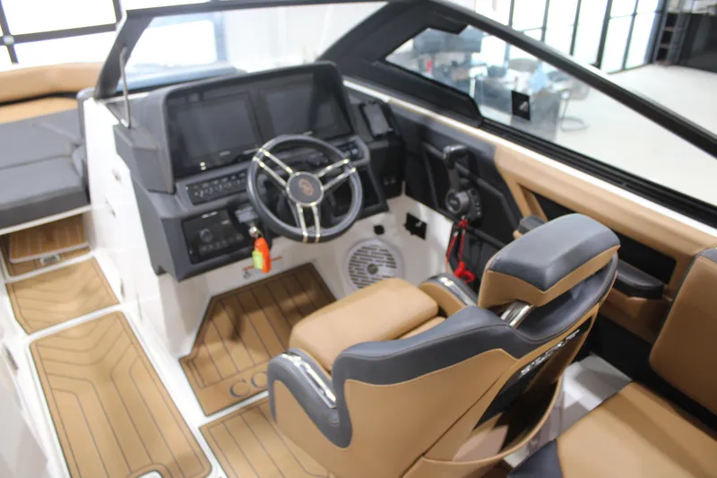 Slide: The Image of 2022 Cobalt R6 Surf boat interior with modern dashboard and luxurious seating. - 11