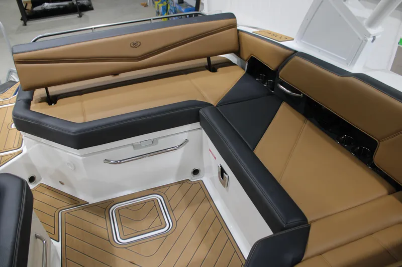Slide: The Image of 2022 Cobalt R6 Surf boat interior with tan and black seating. - 16