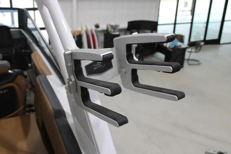 Slide: The Image of Wakeboard rack on 2022 Cobalt R6 Surf boat, indoor showroom setting. - 19