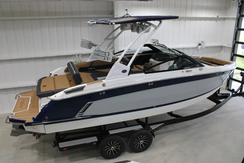 Slide: The Image of 2022 Cobalt R6 Surf boat in showroom, featuring sleek design and modern amenities. - 3