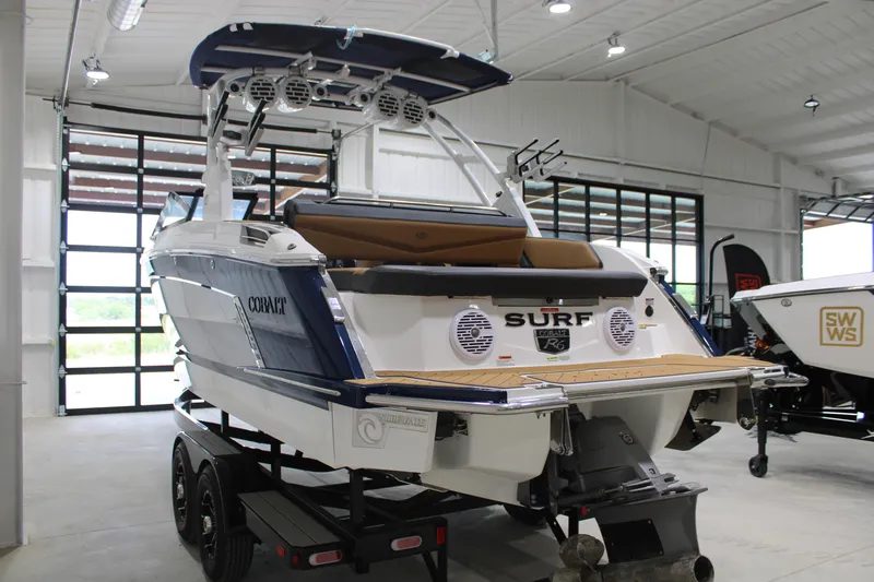 Slide: The Image of 2022 Cobalt R6 Surf boat in showroom, showcasing sleek design and modern features. - 6