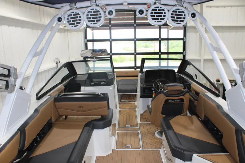 Slide: The Image of Interior of 2022 Cobalt R6 Surf boat with luxurious seating and modern dashboard. - 8