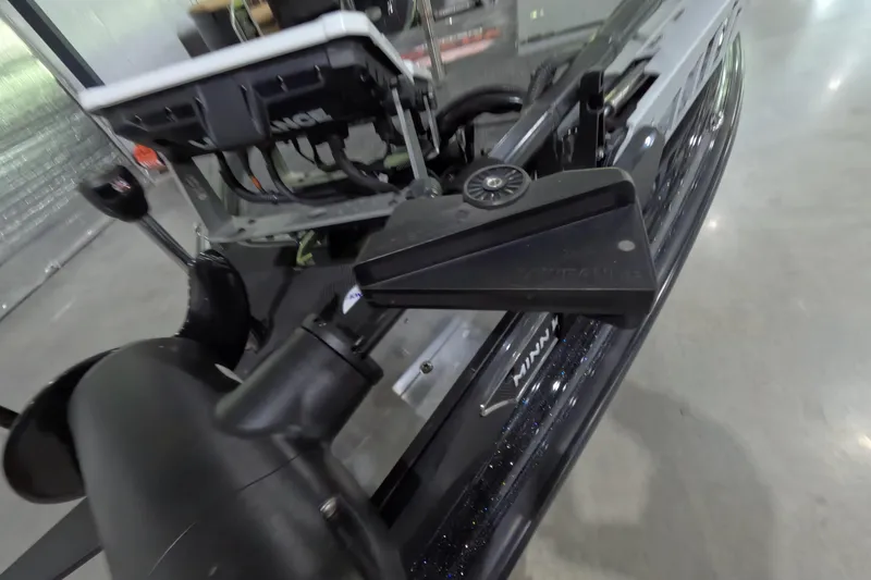 Slide: The Image of Close-up of 2023 Phoenix 921 Elite boat's advanced trolling motor system in a showroom. - 13