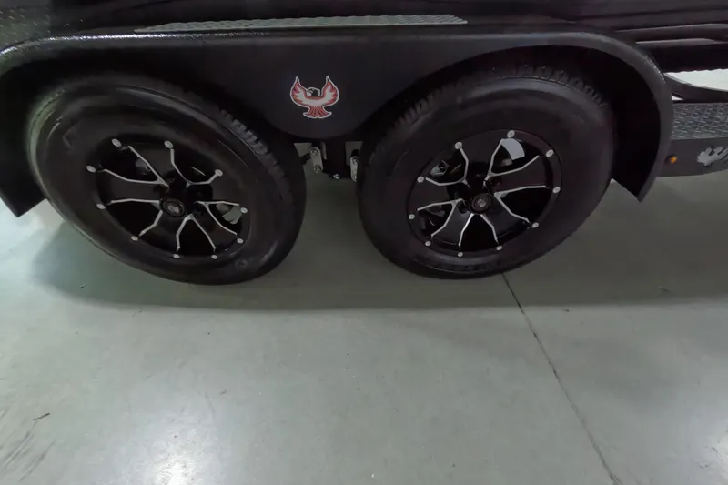 Slide: The Image of 2023 Phoenix 921 Elite trailer wheels with stylish black rims and logo. - 15