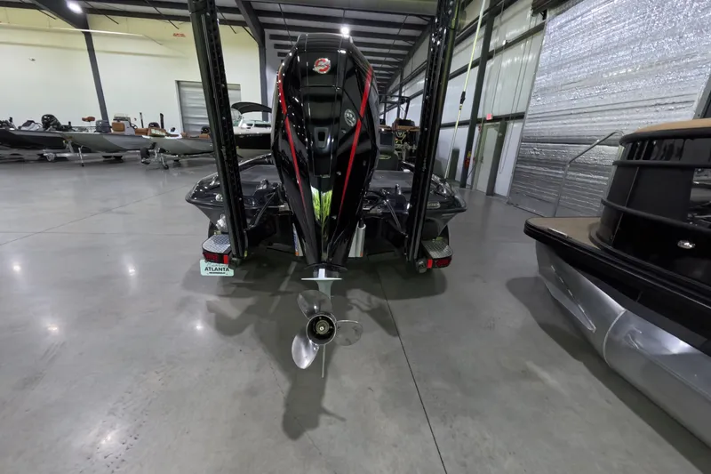 Slide: The Image of 2023 Phoenix 921 Elite boat in showroom, rear view with motor and propeller. - 6