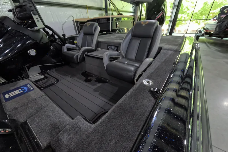 Slide: The Image of 2023 Phoenix 921 Elite boat interior with dual seats and sleek design. - 9