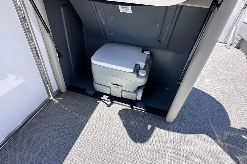 Slide: The Image of Portable toilet in 2024 Sylvan Mirage 8522 LZ boat interior. - 17