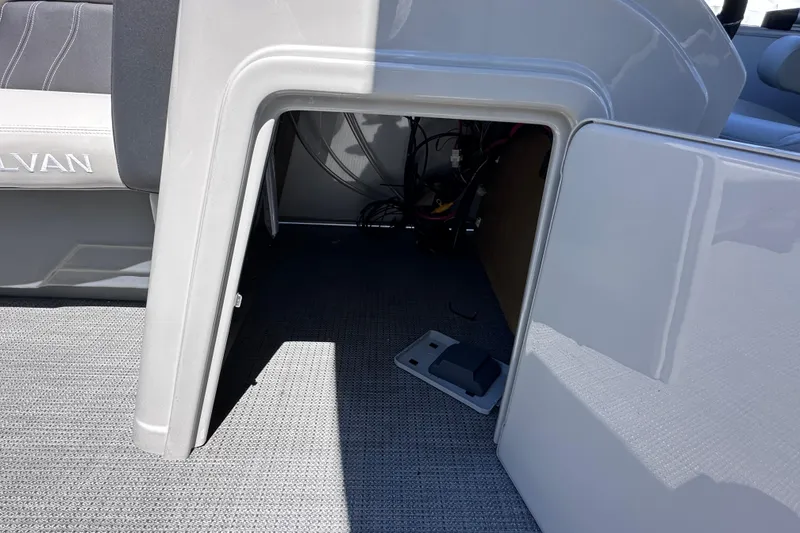 Slide: The Image of Open storage compartment in 2024 Sylvan Mirage 8522 LZ boat interior. - 19