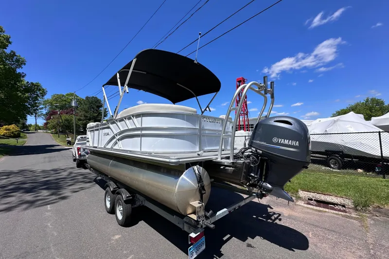 Slide: The Image of 2024 Sylvan Mirage 8522 LZ pontoon boat with Yamaha engine on trailer. - 2