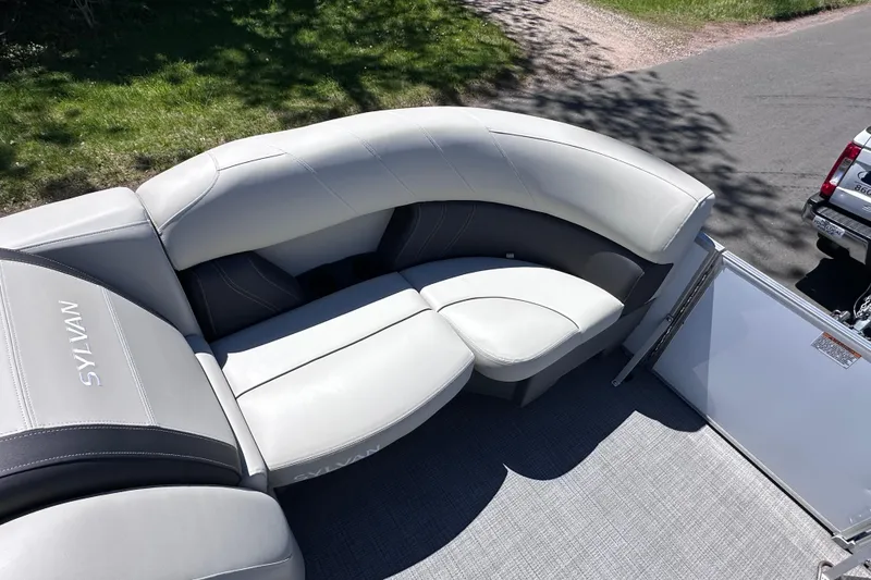 Slide: The Image of Luxurious seating on 2024 Sylvan Mirage 8522 LZ pontoon boat, featuring elegant gray upholstery. - 21