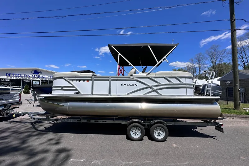 Slide: The Image of 2024 Sylvan Mirage 8522 LZ pontoon boat on trailer at Petzold's Marine Center. - 3