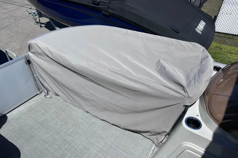 Slide: The Image of 2024 Sylvan Mirage 8522 LZ boat seat covered with a protective gray cover. - 30