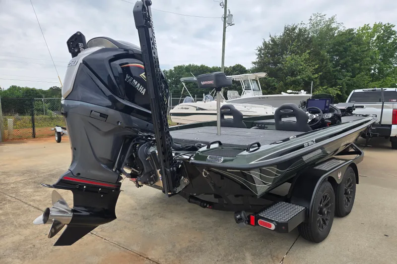 Slide: The Image of 2026 Phoenix 921 Elite X boat with Yamaha engine, parked on a trailer. - 11