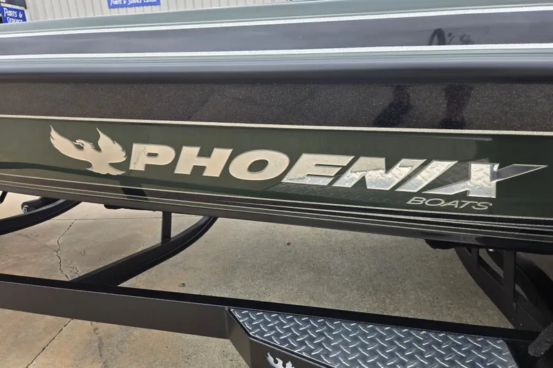 Slide: The Image of 2026 Phoenix 921 Elite X boat logo on a trailer, showcasing sleek design. - 19