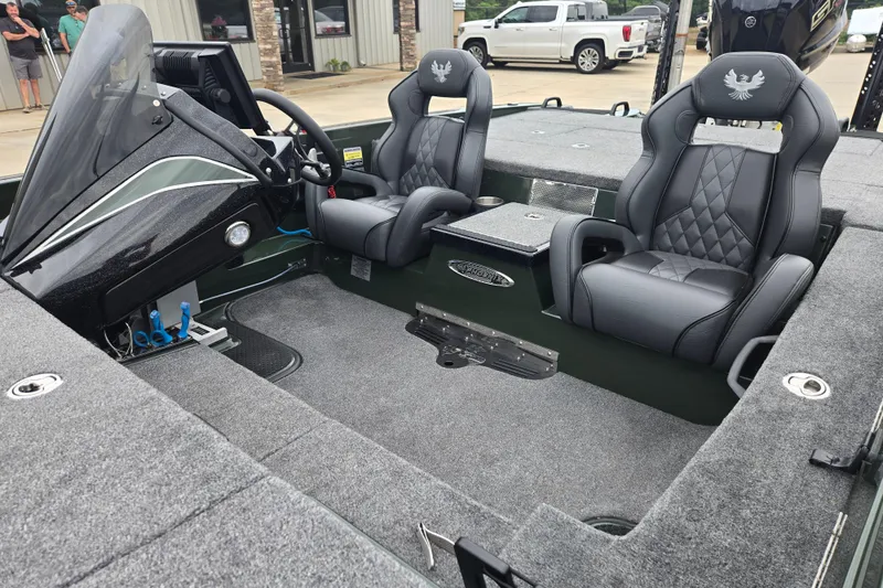 Slide: The Image of 2026 Phoenix 921 Elite X boat interior with dual leather seats and modern dashboard. - 22