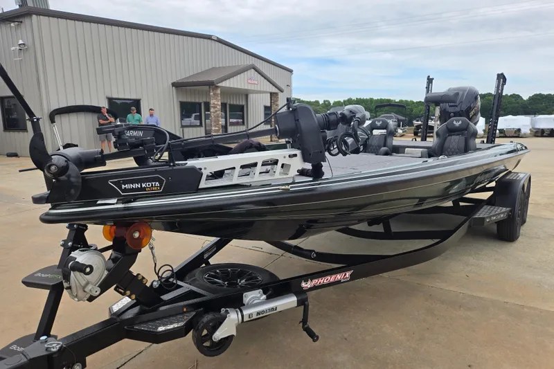 Slide: The Image of 2026 Phoenix 921 Elite X boat with Minn Kota Ultrex motor on trailer. - 4