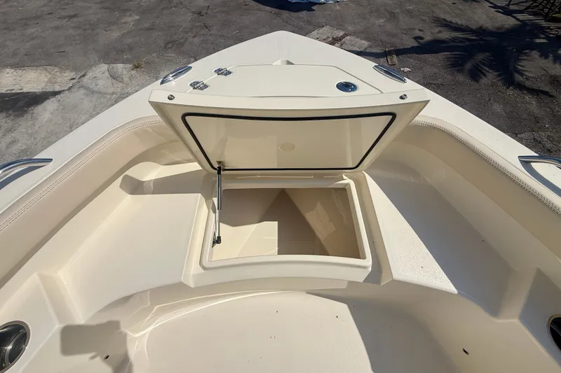 Slide: The Image of 2026 Scout 188 Sport Dorado boat with open storage compartment on deck. - 14