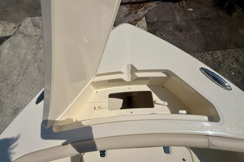 Slide: The Image of Open storage compartment on 2026 Scout 188 Sport Dorado boat deck. - 18