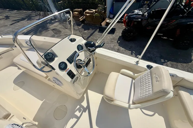 Slide: The Image of 2026 Scout 188 Sport Dorado boat interior with steering wheel and seating. - 5