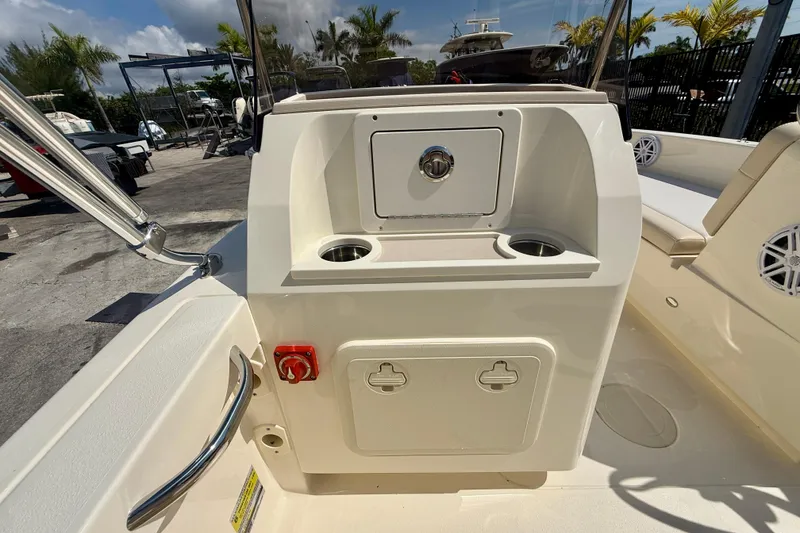 Slide: The Image of 2026 Scout 188 Sport Dorado boat console with cup holders and storage compartments. - 6
