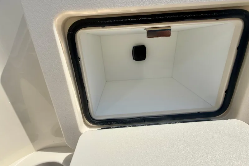 Slide: The Image of Storage compartment of 2026 Scout 188 Sport Dorado boat, open and empty. - 7