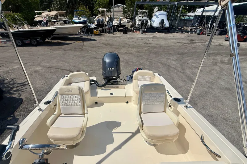 Slide: The Image of 2026 Scout 188 Sport Dorado boat interior with seating and outboard motor. - 8