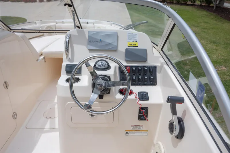 Slide: The Image of 2018 Grady-White Freedom 215 boat dashboard with Garmin navigation system. - 16