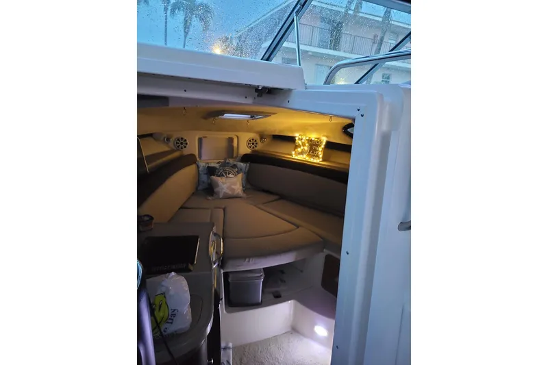 Slide: The Image of Cozy interior of a 2004 Wellcraft 290 Coastal boat with ambient lighting. - 15