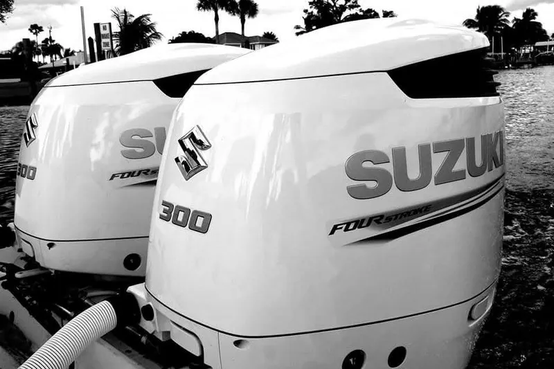 Slide: The Image of Twin Suzuki 300 outboard engines on a 2004 Wellcraft 290 Coastal boat. - 24