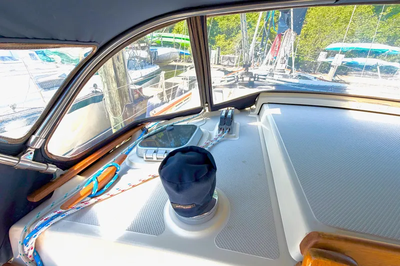 Slide: The Image of Interior view of a 1992 Island Packet 29 sailboat cockpit with ropes and winch. - 13