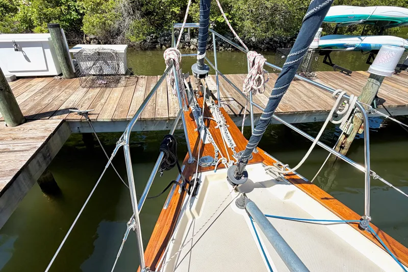Slide: The Image of 1992 Island Packet 29 sailboat docked, showcasing deck and rigging details. - 3