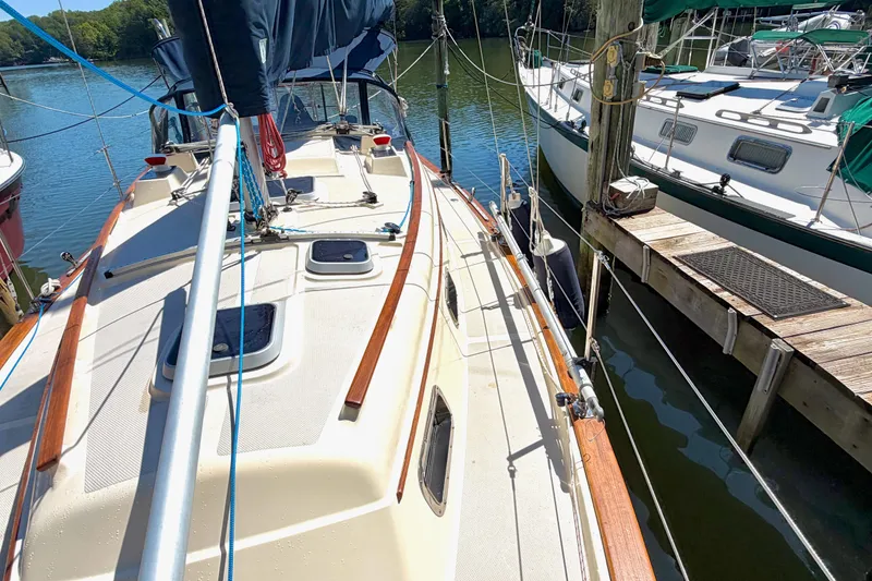Slide: The Image of 1992 Island Packet 29 sailboat docked, showcasing deck and rigging details. - 4
