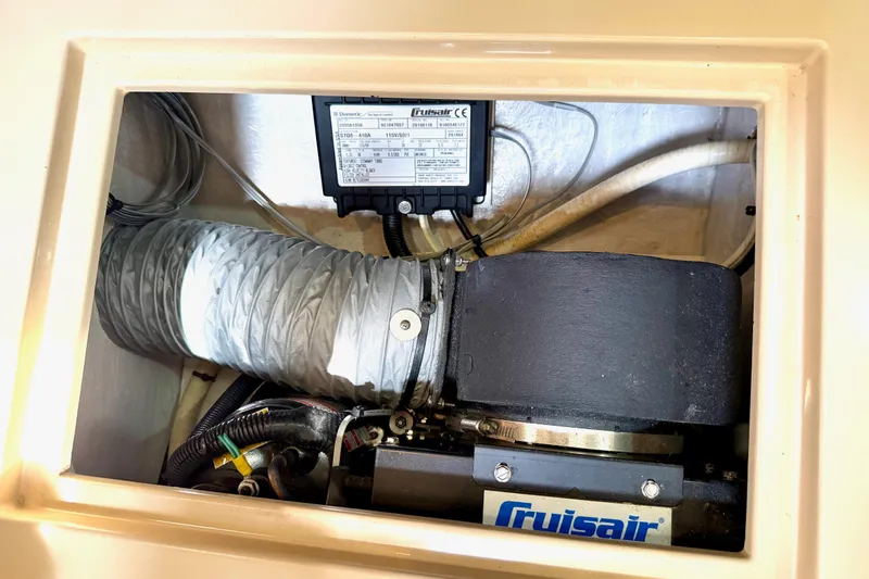 Slide: The Image of Cruisair unit in 1992 Island Packet 29 sailboat, showcasing ventilation and wiring components. - 41